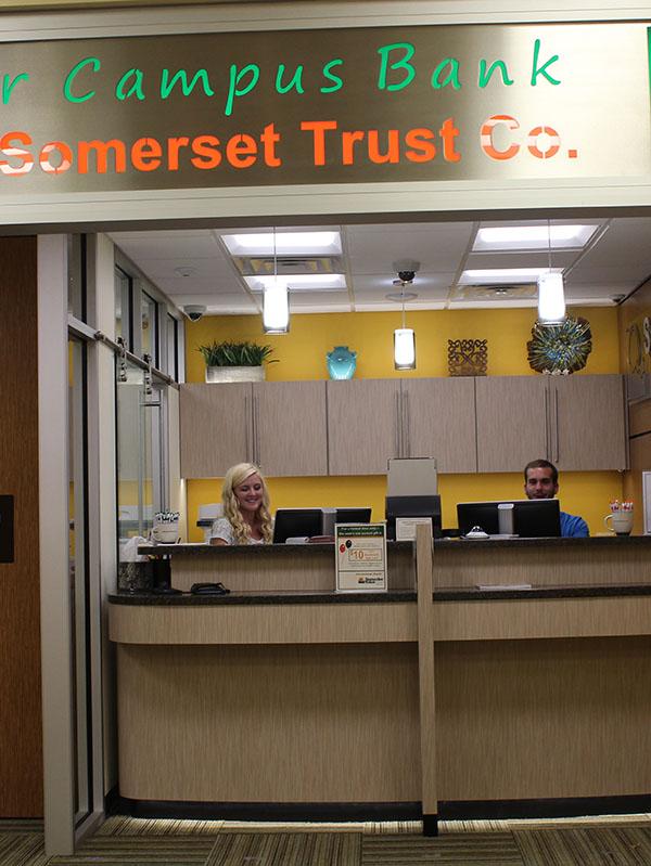 Employees Marie Bontrager and Mike Stibich waiting to help customers.
