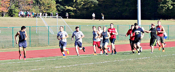 Pitt-Johnstown’s Rugby Club team members run during practice this past week. The team defeated Allegheny College Saturday, 22-15.