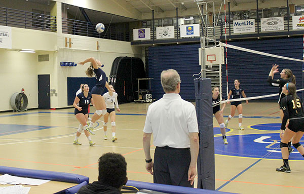 Sophomore Logan McIntosh winds up to send the ball over the net in last Friday’s defeat of Millersville University inside the Sports Center.