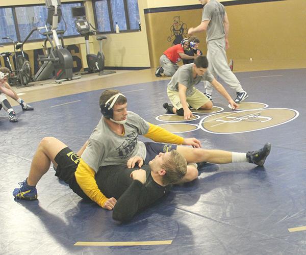 Freshman Noah Burkhart pins freshman Mitch Fitzgerald Wednesday in preparation for the conference tournament held in Erie, Pa on Saturday.
