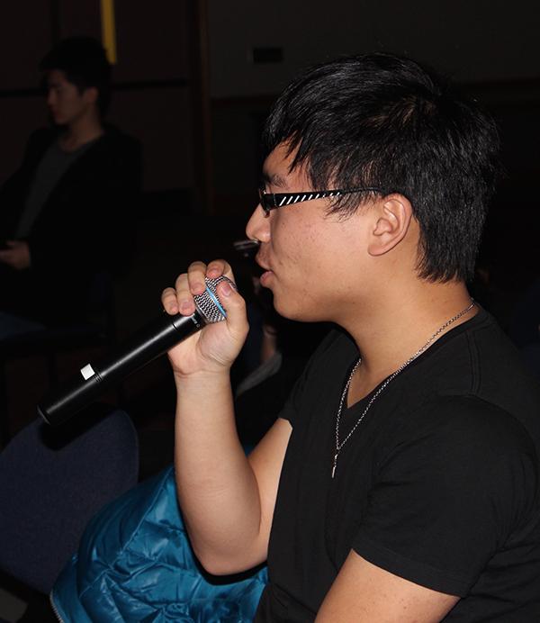 Freshman Liu Che sings in a karaoke event held by the Chinese Students and Scholars Association Jan. 15 in the Cambria room. 