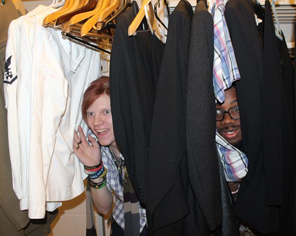 Freshman Patrick Cadden (left) and junior Demar Watson (right) hide among costumes in a dressing room at the Pasquerilla Performing Arts Center while at a play practice.