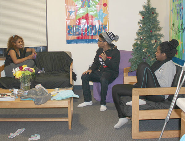 Dana Dyer, TJ Mitchell-Scott and Kami Brown, all sophomores, decorate for a roommate’s birthday in a Willow Hall’s suite.