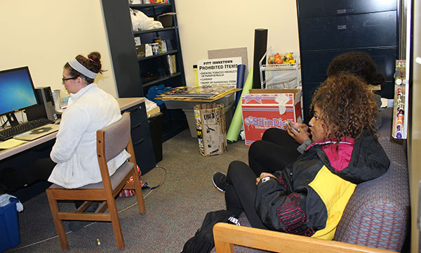 Sophomores Clarissa Nepereny (left) and Dana Dyer sit during a Programming Board meeting March 21. Programming Board is Student Government Association’s largest budget. 