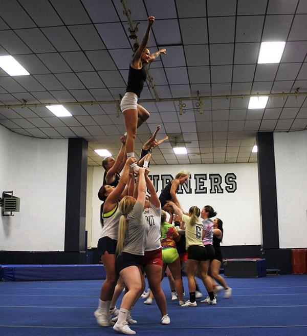 Captain flyer  Heather Rodver in the air during practice last week before leaving for Daytona to compete in nationals.