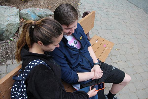 Seniors Meagan Ruefle and Ryan Siatkowsky look over information stored on Sodexo’s new menu app. 