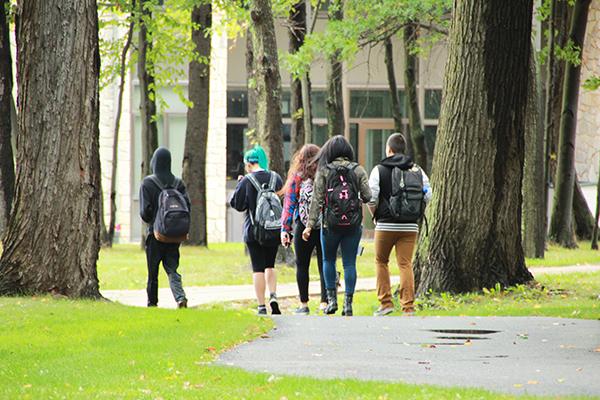 Students walk on trails between Willow Hall and Biddle Hall.