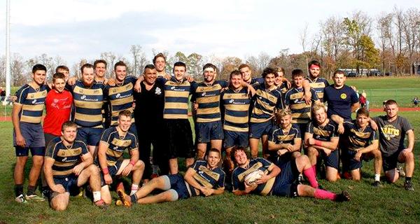 The undefeated Pitt-Johnstown rugby team poses after their 27-10 victory against Saint Francis University Saturday, ending their regular season.