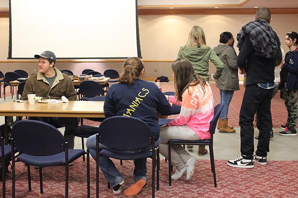 Students enjoy free food in the Student Union’s Cambria Room Dec. 2 during a collaborative game night hosted by three clubs’ members.