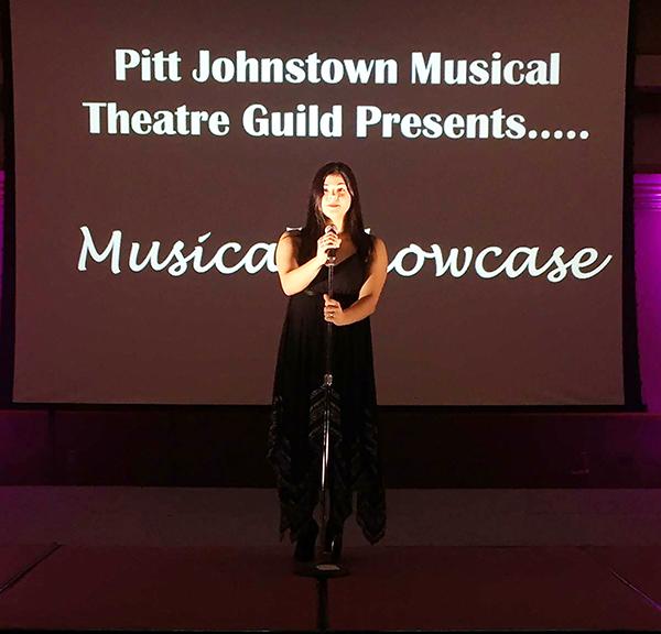 Senior Madison Nick speaks at the musical showcase Dec. 3, 2015 in the Cambria Room. | Photo: Sharon Wiant. Senior Madison Nick speaks at the musical showcase Dec. 3, 2015 in the Cambria Room.