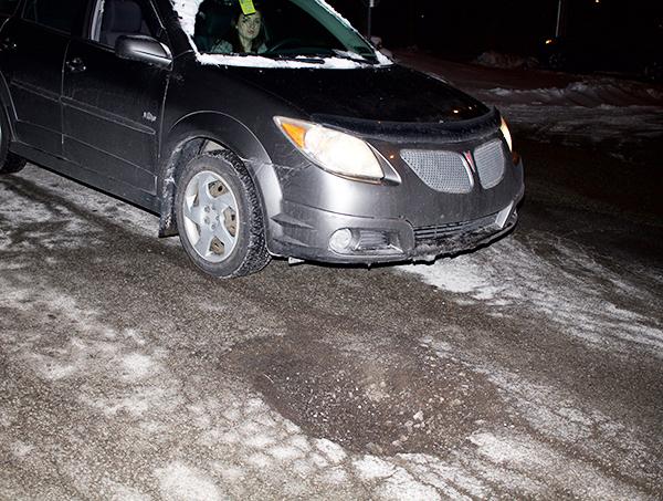 Sophomore Erin Whyte avoids a pothole near the Pasquerilla Performing Arts Center. 