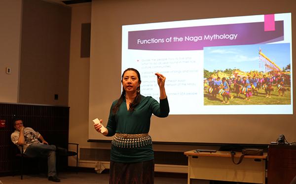 Professor Tuangtip Klinbubpa-Neff (Noon) explained dragon mythology to a nearly full auditorium audience March 20 in Blackington Hall. 