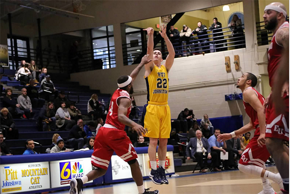 Pitt-Johnstown senior guard Jake Laravie attempts a 3-pointer on Feb. 4 against Edinboro University. 