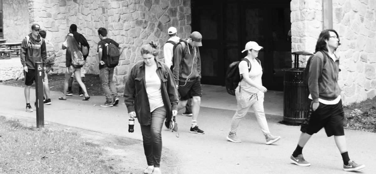 Students walk past the Student Union, which soon may become more branded with school pride. 