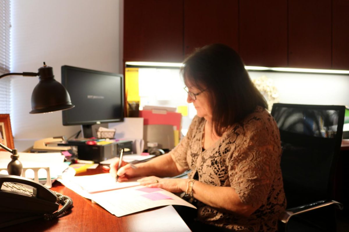 Health and Counseling Director Shelley Peruso works at her desk in the Student Union’s Health Services Office. 