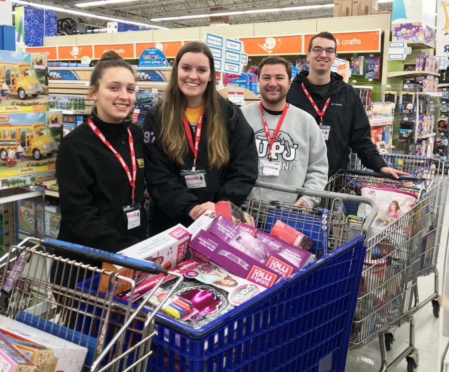 Student government members (left-right) Keirstin Ward, Gretchen Sheppard, Brady Willis and Joe Evanko particapate in a toy buy at Toys R Us Nov. 7 