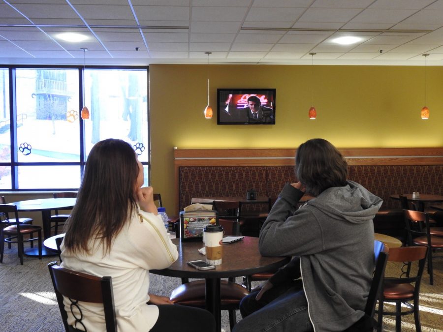 Students Abigail Moran (left-right) and Trevor Belding watch TV near Brioche Dorée cafe in the Student Union. Internet protocol television is to be installed by March 6. 