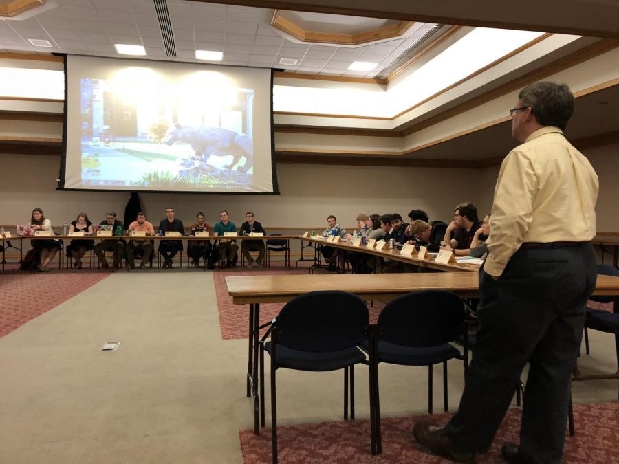 Owen Library Director Peter Egler talks to student government senators about the library’s resources at a Feb. 27 meeting.