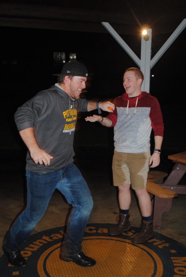 Baseball catcher Mason Prickett snatches an egg out of Reid Walter’s hand. 