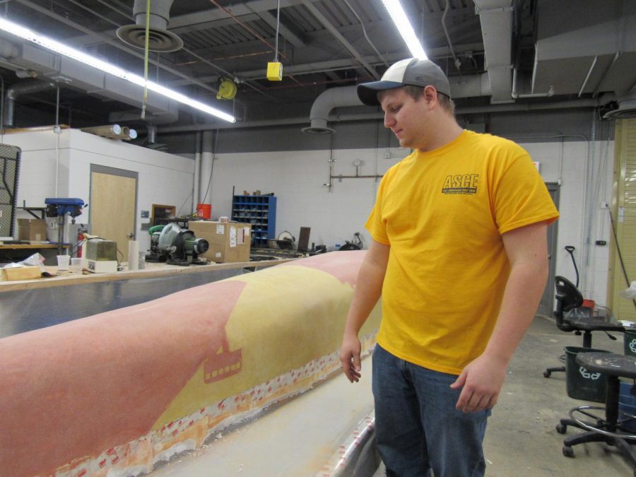 Concrete Canoe captain Justin Towsey shows off canoe progress as of early March. 