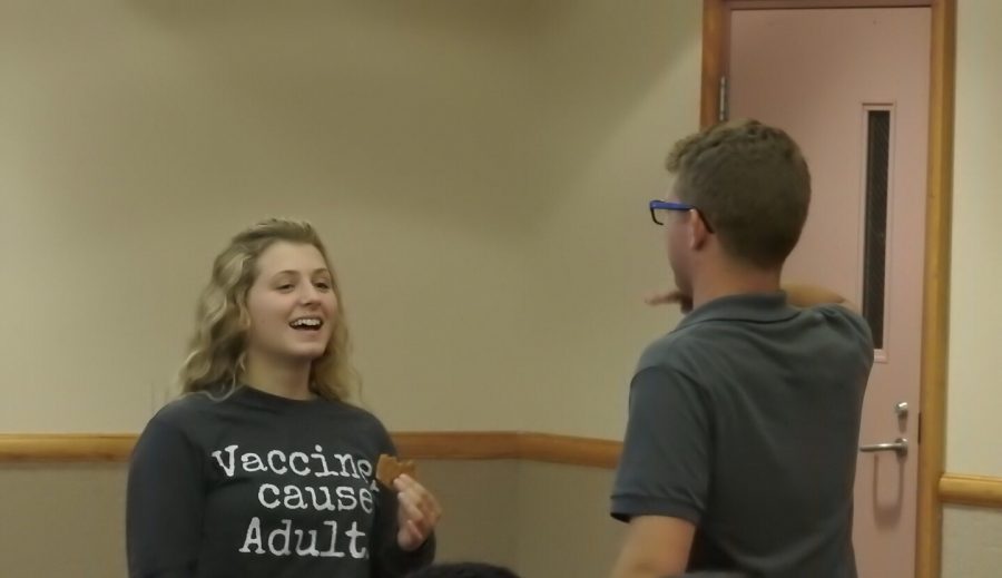 Junior Hannah Brown talks with student government President Sam Miller during an Aug. 27 meet-the-senators meeting. Brown was one of the few to attend the meeting. 
