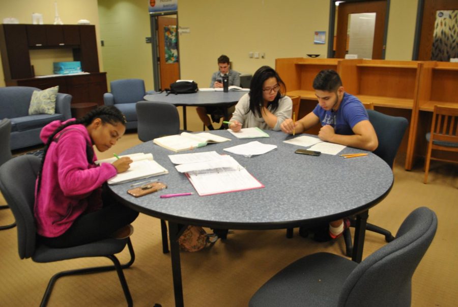 (Left to right) Students Jordyn Ford, Kaila Yuazon and Muhammad Quraishy work on math problems at drop-in tutoring in the Academic Success Center last week. 