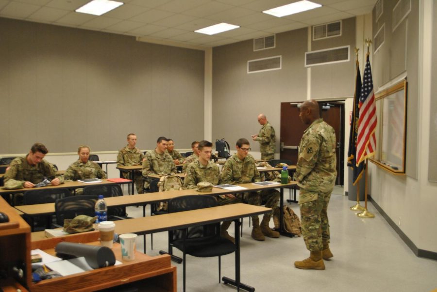 Major Bruce Jordan (right) instructs cadets in their one Pitt-Johnstown lecture, covering topics such as weapons systems and land navigation.