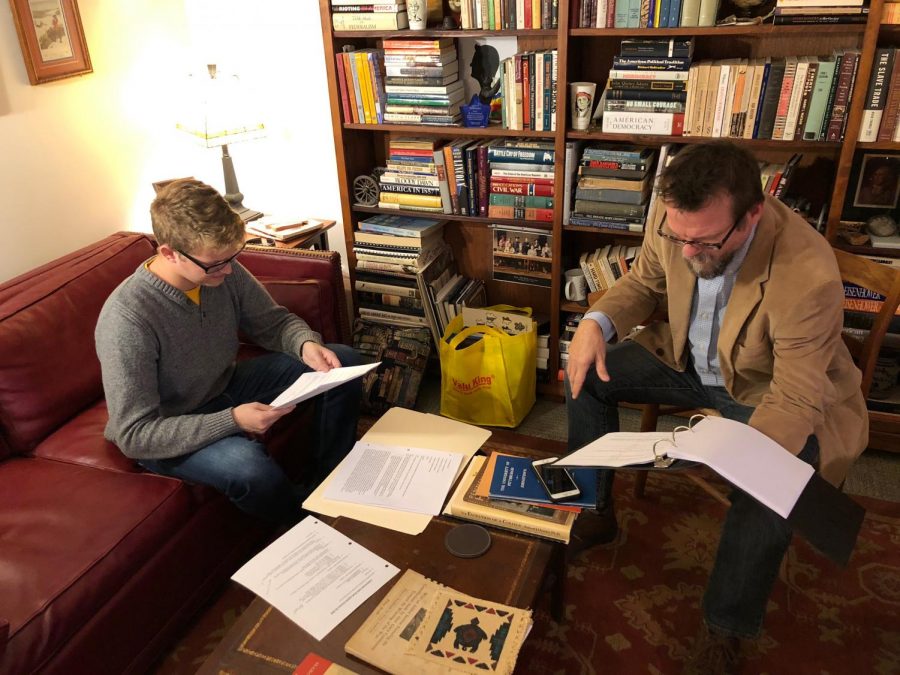 Senior Sam Miller (left) reads his lines for a major role in “Canfessional,” a film in three parts that history professor Paul Newman (right) wrote and is directing for entry in film festivals. 