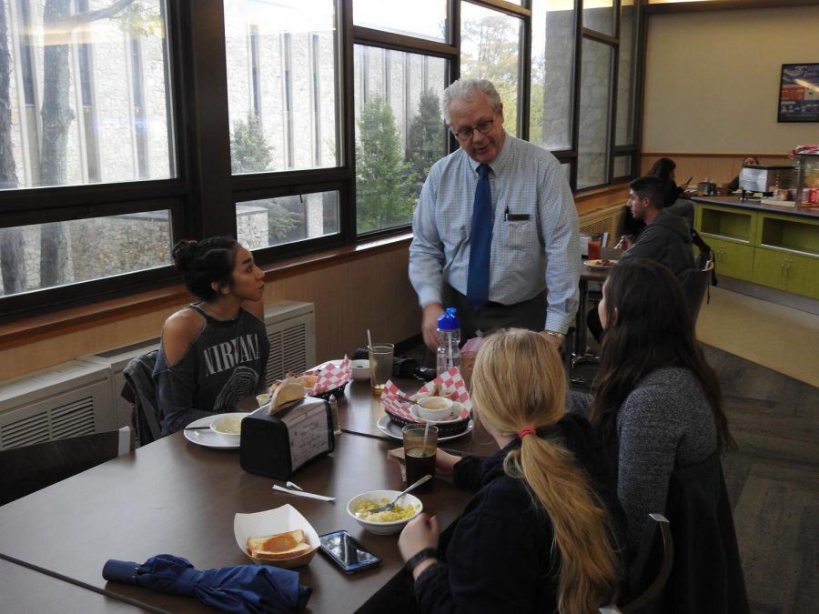Sodexo General Manager James Butler speaks with students in the Student Union Dining Hall on Oct. 29. 