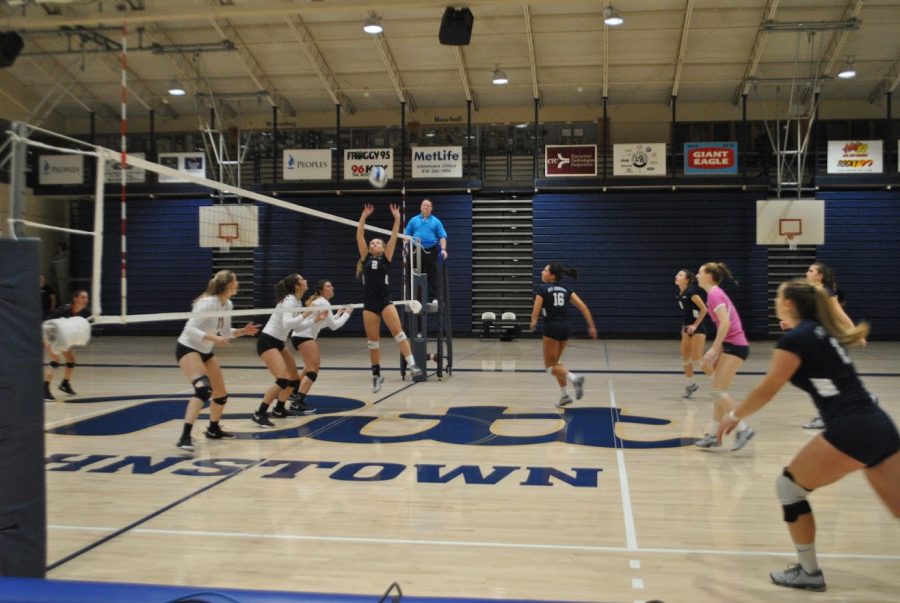 Sophomore J.C. Longeville (No. 2, center) sets the ball for her teammates in the volleyball team’s first round conference playoff game agsinst California (Pa.) University last Wednesday at the Sports Center. The volleyball players lost 2-3.
