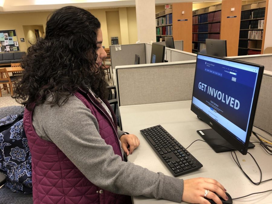 Sophomore Ana Gonzalez looks at the newly updated Pitt-Johnstown website Nov. 8 in Owen Library.