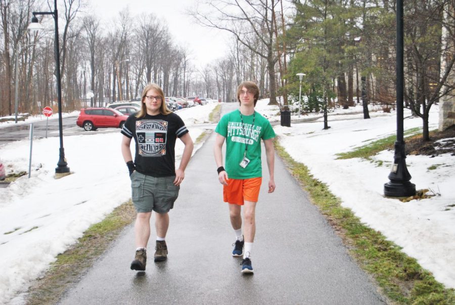 Sophomores Ben Campbell (left) and Logan Rickley (right) wear shorts in winter weather Thursday.