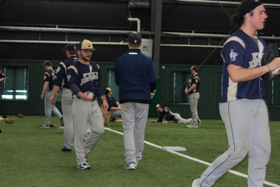 Men’s baseball team members work out Jan. 28 at the Iron Horse Baseball Complex, preparing for their first competition.