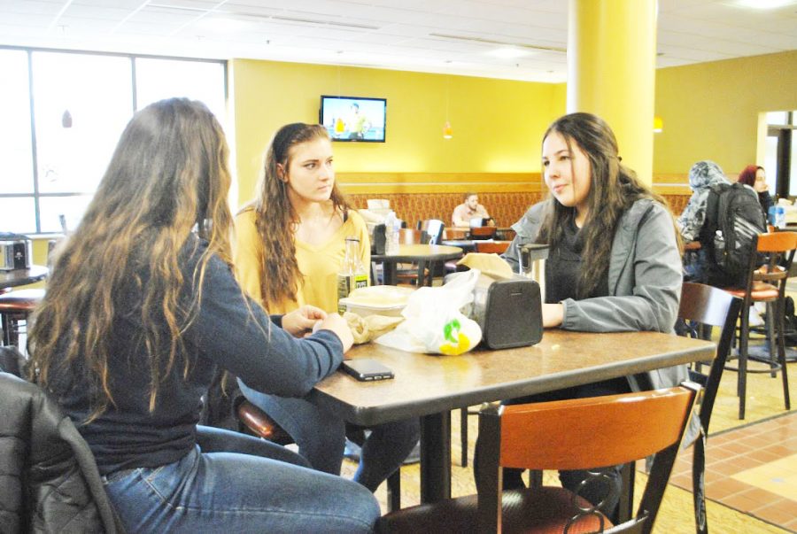 Sophomore Tessa Fry (left), junior Emily Kaczmarek (center) and sophomore Isa Lanthaler (right) hang out in the Student Union on Feb. 8.