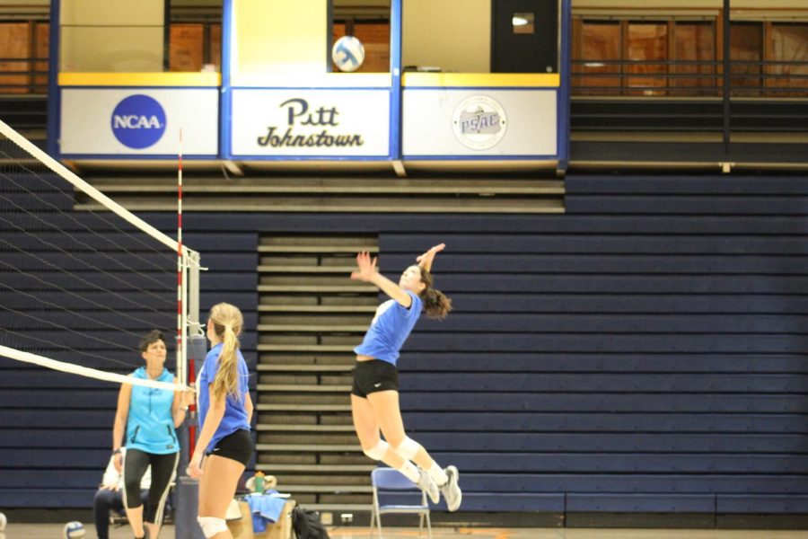 Sophomore Cassie Pascarella (right) tries to make a kill during practice Oct. 24 at the Pitt-Johnstown Sports Center.