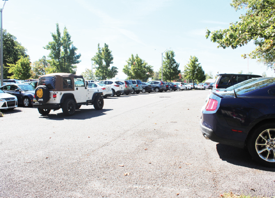 A student circles a crowded Biddle parking lot in search of a parking space.  Some students have been complaining that there is not enough parking spaces provided for the number of students on campus. 