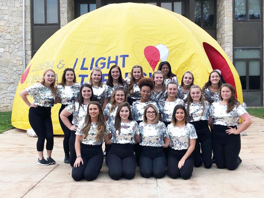 Dance Ensemble members posing before they performed at he Light the Night walk Oct. 5.