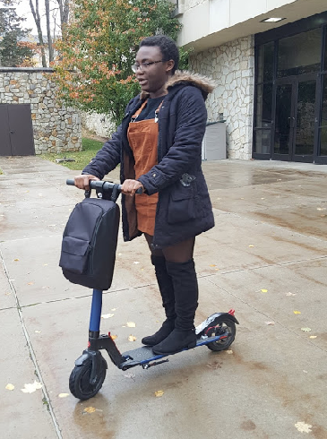 Sophomore Shunterra Davis rode her scooter in front of the Academic Success Center Thursday.