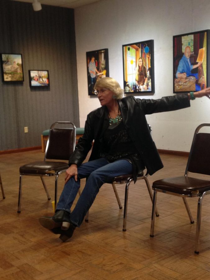 Artist Heather Davis speaks at her exhibition “The Gift of Color” at the Community Arts Center of Cambria County Jan. 25.  Her exhibit is to be on display until Feb. 28. 